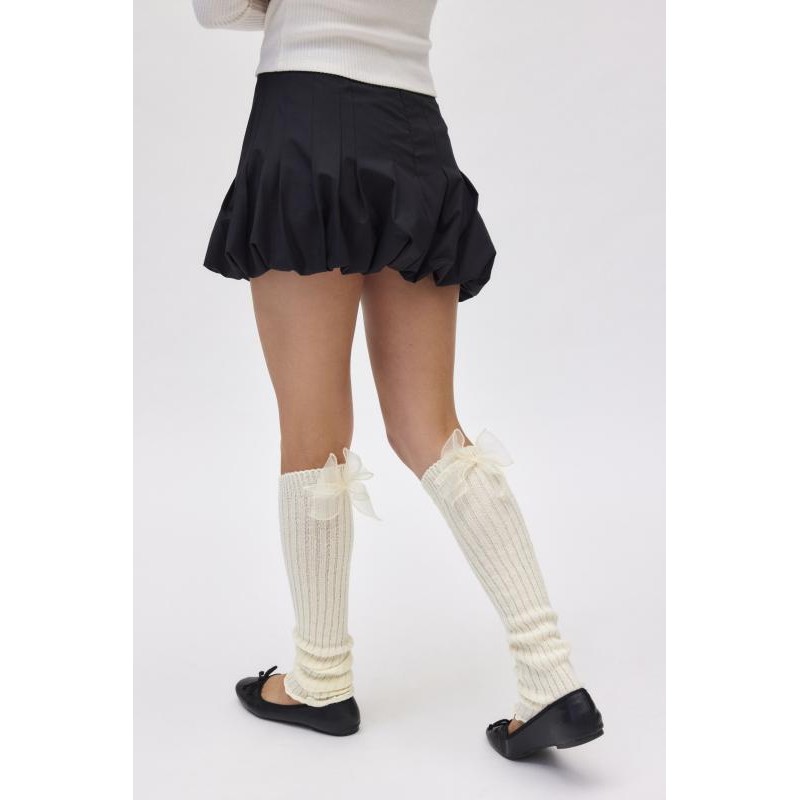 Calientapiernas de punto acanalado con lazo